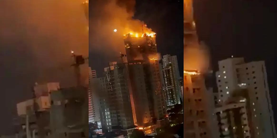 Incêndio que tomou grandes proporções teria começado por conta de um curto-circuito no últimos andares. (Redes Sociais/Reprodução)